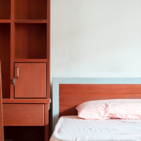 Empty Bedroom of student dormitory in the university, clean interior hostel