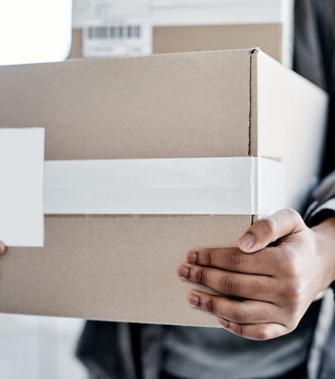 Your cargo, handled with care. Cropped shot of a man delivering a package to a place of residence.